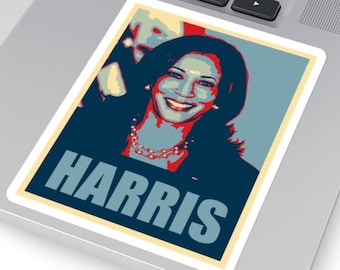May include: A red, white, and blue political poster with a woman's face and the word "HARRIS" in large, bold letters.