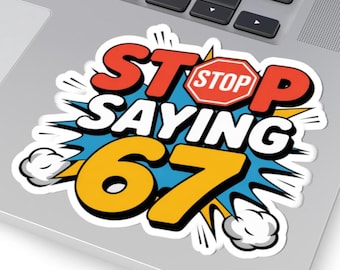 May include: A sticker with the words "STOP SAYING 67" in a comic book style. The word "STOP" is in a red octagon, and the number "67" is in yellow. The sticker is on a laptop.