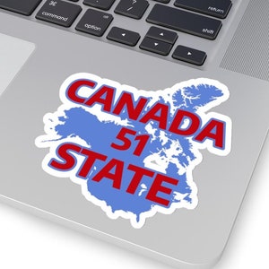 May include: A blue outline of Canada with the text "CANADA 51 STATE" in red letters on a laptop.