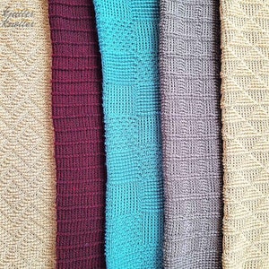 May include: Five different textured fabric swatches in beige, burgundy, teal, gray, and cream.