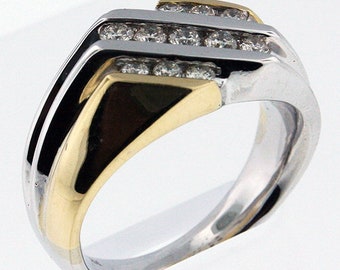 May include: A gold and silver men's ring with a diamond band. The ring has a unique design with two rows of diamonds set in a chevron pattern.