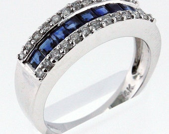May include: A silver band ring with a row of blue sapphires and a row of diamonds.