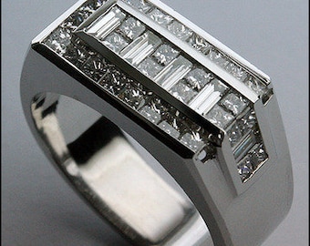 May include: A silver ring with a rectangular band set with a row of baguette diamonds and a row of round diamonds.