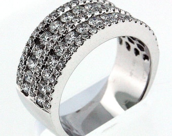 May include: A silver band ring with a wide band of pave set diamonds.