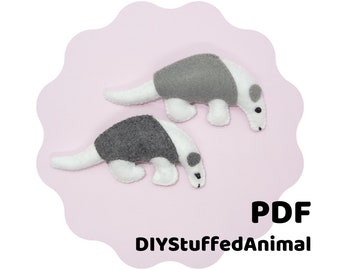 May include: A PDF pattern for a DIY stuffed animal, featuring two gray and white anteaters. The pattern is available for download from DIYStuffedAnimal.
