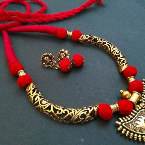 black metal jhumkas and necklace