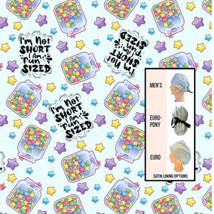 May include: Light blue fabric with a repeating pattern of jars filled with colorful star-shaped candies and stars. Text reads "I'm Not SHORT I Am FUN SIZED". Includes options for men's, euro-pony, and euro satin-lined head coverings.
