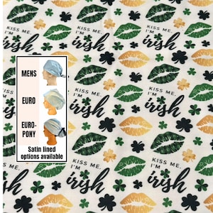 May include: White fabric with a repeating pattern of green lips, shamrocks, and the text "Kiss Me, I'm Irish" in black script. The image also shows examples of surgical scrub caps in different styles.
