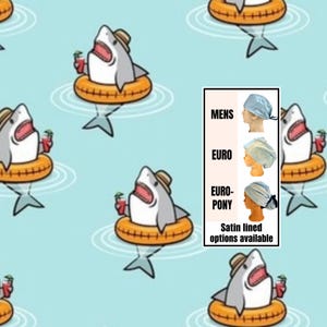 May include: A repeating pattern of cartoon sharks in a pool, each wearing a hat and floating on an orange inner tube, holding a drink. A small box shows different styles of surgical caps, including "MENS", "EURO", and "EURO-PONY", with "Satin lined options available" text.