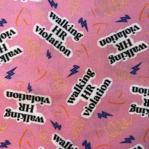 May include: Pink fabric with a repeating pattern of the text "walking HR violation" in a white font with a black outline. The design includes purple lightning bolts and orange and yellow squiggles.