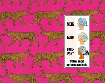 May include: A pink background with a repeating pattern of gold leopard print. The image also features three different styles of satin-lined head coverings in light blue, with the text "MENS", "EURO", and "EURO-PONY" and the text "Satin lined options available".