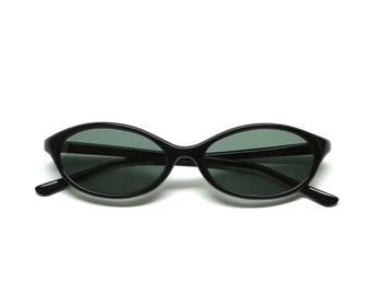 May include: Black oval sunglasses with dark green lenses.