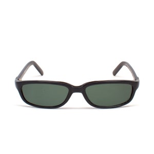 May include: Black rectangular sunglasses with dark green lenses.