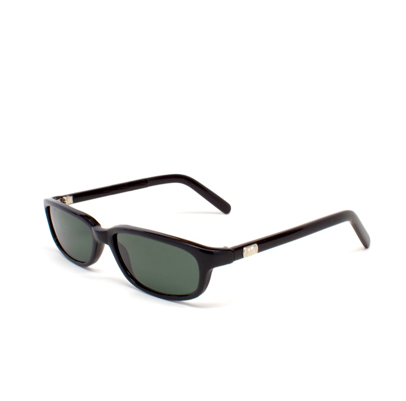 May include: Black plastic sunglasses with dark green lenses. The sunglasses have a rectangular shape and a thin frame.