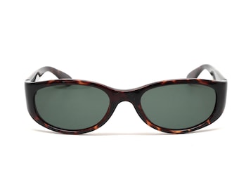 May include: A pair of tortoiseshell oval sunglasses with dark green lenses.