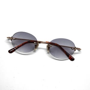 True Vintage 90s Grey Frameless Deadstock Oval Sunglasses