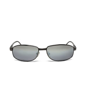 May include: Black rectangular sunglasses with silver mirrored lenses. The frames are a dark, matte finish. The temples curve gently to fit over the ears. The sunglasses are set against a white background.
