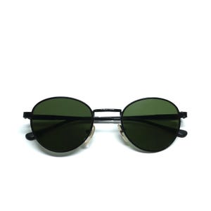 Occhiali da sole vintage anni '90 con montatura circolare in filo nero