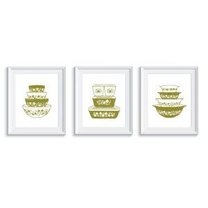 May include: Three framed prints of vintage green and white floral patterned kitchenware. The prints feature a set of mixing bowls, a casserole dish, and a set of storage containers.