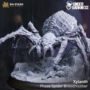 May include: A detailed, gray Phase Spider Broodmother miniature, labeled "Xylanth." The model features intricate details, including multiple eyes, segmented legs, and a textured carapace. The base includes skeletal remains and rocky terrain, with the "Under Darkness" logo.