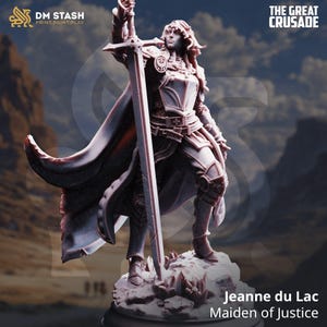 May include: A detailed figurine of Jeanne du Lac, the Maiden of Justice, holding a large sword aloft. The figure is clad in armor and a flowing cape. The base is textured to resemble a rocky outcrop. The text "The Great Crusade" and the DM Stash logo are visible.