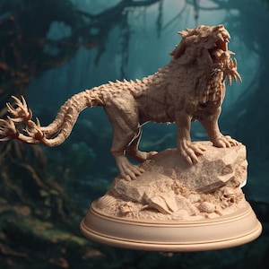 May include: A detailed, beige-colored, sculpted figurine of a mythical creature with a lion-like body, a long, spiky tail, and a snarling face. The creature is standing on a rock base with a smaller rock and seashells at its feet.