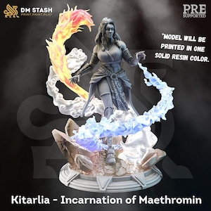 May include: A gray resin figurine of a character named Kitarlia, Incarnation of Maethromin, standing on a circular base. The figure is surrounded by swirling elemental effects of fire and water. Text on the image reads: Model will be printed in one solid resin color.