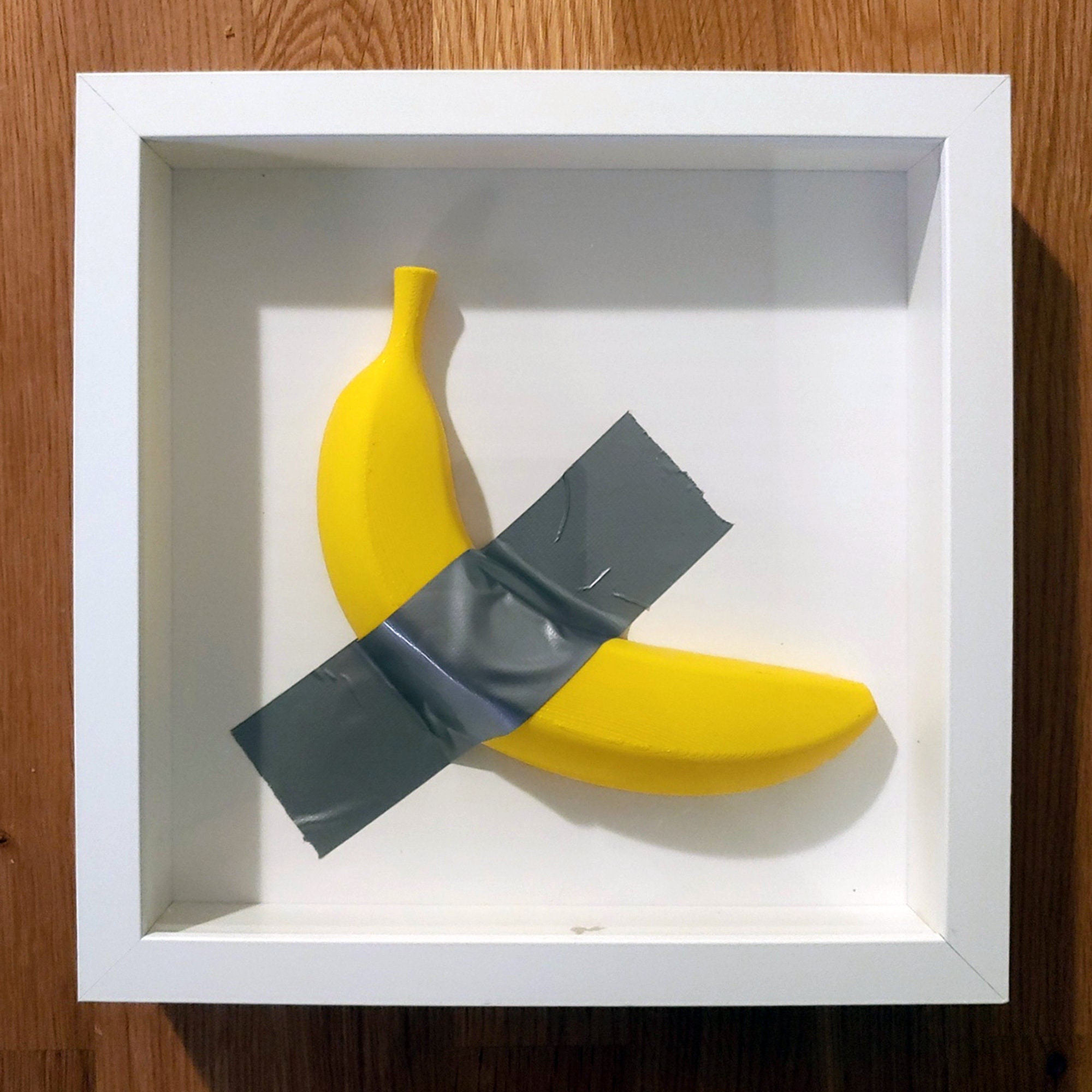 Framed Boujee Banana is a 3d Printed Banana Taped Inside a
