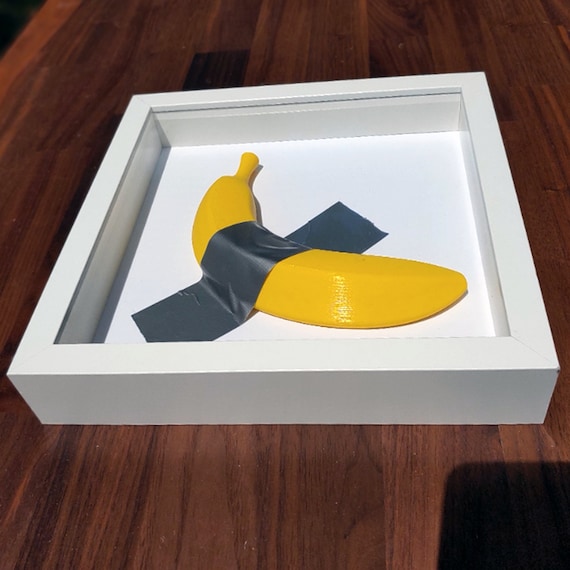Framed Boujee Banana is a 3d Printed Banana Taped Inside a