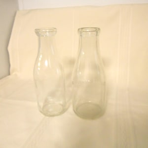 Two Clear Glass One Quart Milk Bottles No Labeling Square and Rounded Bottles