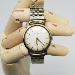 Caravelle 10k rgp bezel stainless steel back sales