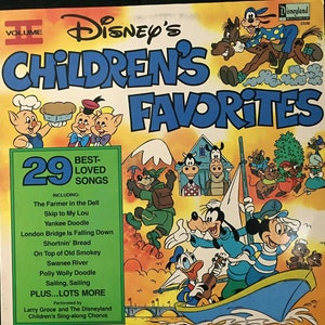 May include: A vintage vinyl record album cover featuring a colorful illustration of Disney characters. The album title is "Disney's Children's Favorites" and includes 29 best-loved songs. The cover features Mickey Mouse, Donald Duck, Goofy, and other Disney characters.