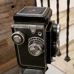 Beautyflex Model D, c1955. TLR Camera -  6x6cm rollfilm with FC Biokor 3.5/80mm lens in Copal-MX B, 1-1/300 sec. shutter.  Vintage