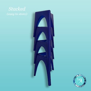 May include: Four blue plastic stools stacked on top of each other. The stools are designed to be easily stored. The text "Stacked (easy to store)" is visible at the top of the image.