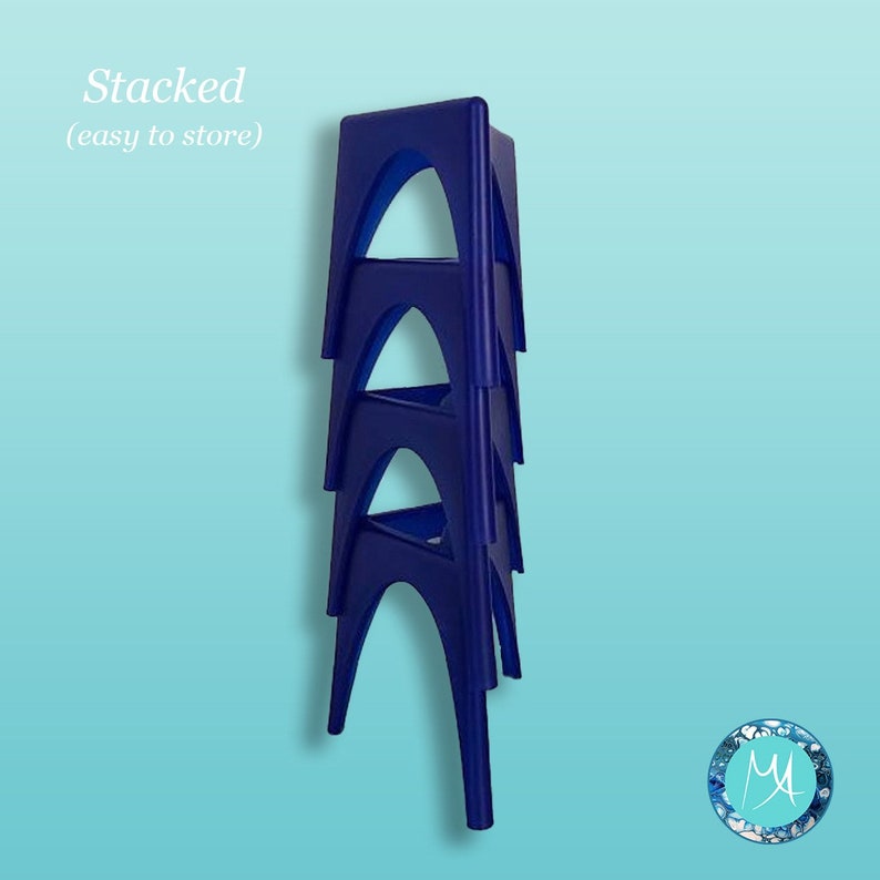 May include: Four blue plastic stools stacked on top of each other. The stools are designed to be easily stored. The text "Stacked (easy to store)" is visible at the top of the image.
