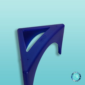 May include: A blue plastic triangular shelf with the text "Molly's Industrial" embossed on the surface.