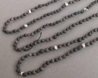 Forebearers | Handmade necklace with smoke fired beads and sand cast pewter skulls