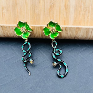 Victorian Style Asymmetric Green Floral Snake Earrings - Gold-Toned Serpent Dangle with Green Flowers and Emerald Accents, Statement Jewelry