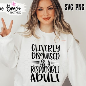 May include: White sweatshirt with black text that reads "Cleverly Disguised as a Responsible Adult".