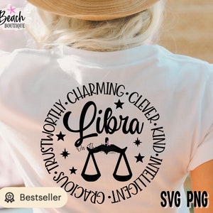 May include: A white t-shirt with a black circle design featuring the word "Libra" and a Libra zodiac symbol. The circle is surrounded by the words "Trustworthy, Charming, Clever, Kind, Intelligent, Gracious".