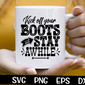 May include: White ceramic mug with black text that reads "Kick off your BOOTS and STAY AWHILE".