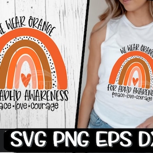 May include: A digital design featuring an orange, brown, and pink rainbow with black polka dots. The text "We Wear Orange for ADHD Awareness Peace-Love-Courage" is written below the rainbow.