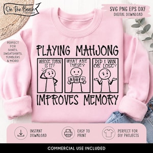 May include: A light pink sweatshirt with the text "PLAYING MAHJONG IMPROVES MEMORY". The design features stick figures and the phrases "WHOSE TURN IS IT?", "WHAT ARE THESE?", and "DID I WIN OR LOSE?". Includes the text "SVG PNG EPS DXF DIGITAL DOWNLOAD".