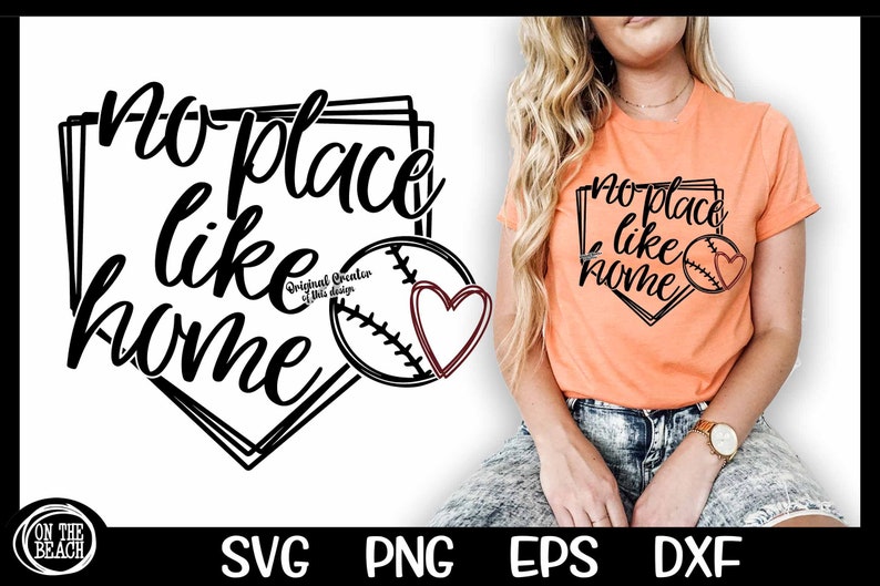 May include: A black and white graphic design of a baseball diamond with the text "no place like home" inside. A baseball with a red heart is in the center of the diamond. A woman is wearing a peach colored t-shirt with the same design printed on it.