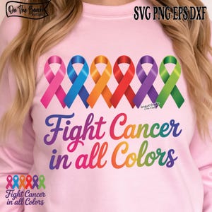 May include: Pink sweatshirt with a rainbow design featuring six colored ribbons and the text "Fight Cancer in all Colors." The design includes pink, blue, orange, red, purple, and green ribbons.