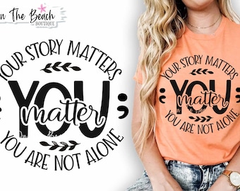 May include: A black and white graphic design with the text "Your story matters: You matter; You are not alone". The graphic features a circle with a stylized branch design and the word "You" in large letters.
