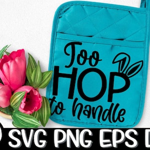 May include: A turquoise blue pot holder with the text "Too HOP to handle" in black lettering. Bunny ears are above the word "HOP".
