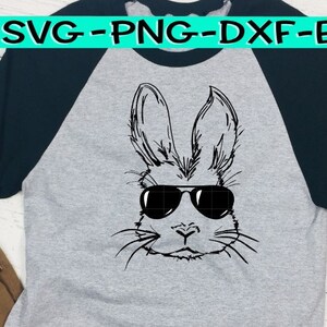 May include: A grey and black baseball tee shirt with a black and white illustration of a rabbit wearing sunglasses. The text "SVG-PNG-DXF-EPS" is printed in black at the top of the shirt.