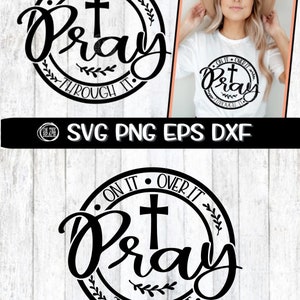 May include: Black and white graphic design with a cross and the text "On it, Over it, Pray, Through it." The design is in a circle with a wreath around it.