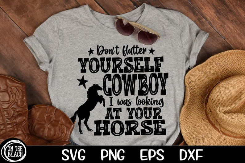 May include: A gray t-shirt with a black silhouette of a horse and the text "Don't flatter yourself cowboy I was looking at your horse".